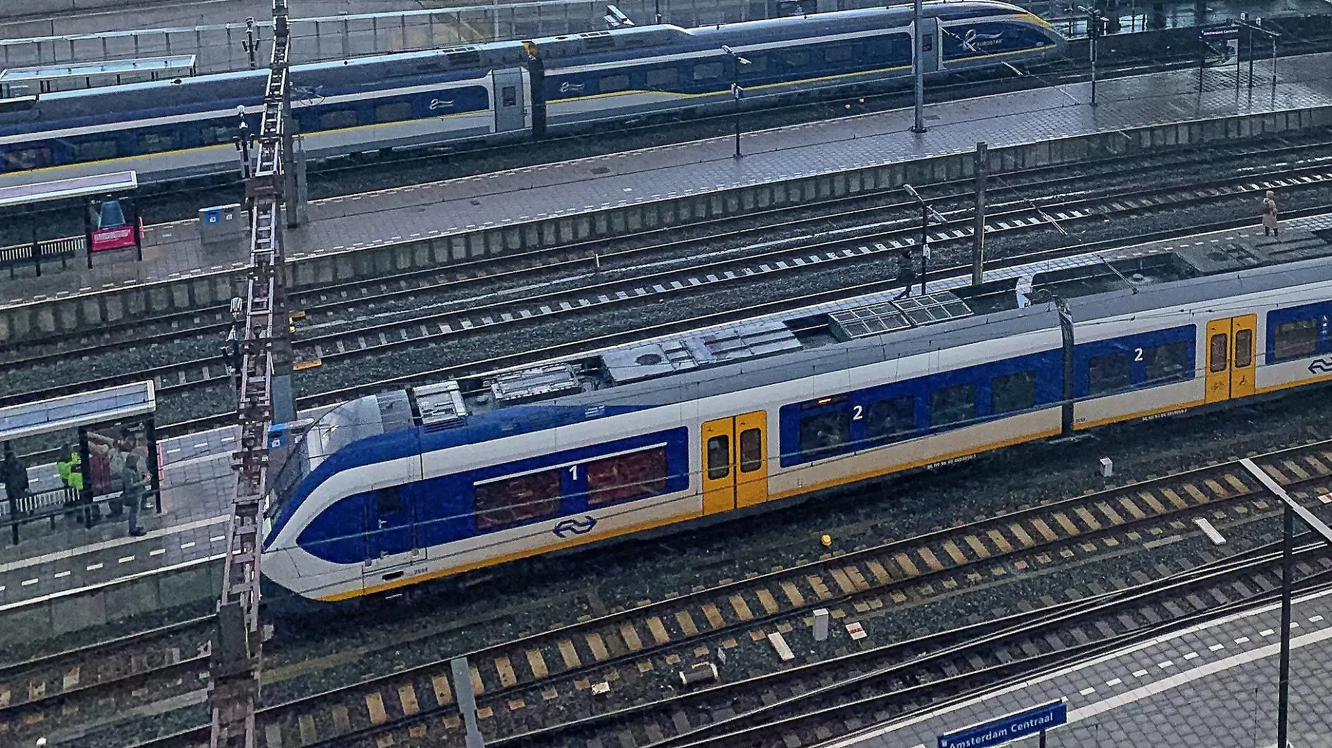 Main railway station with a Eurostar high speed train, Eye Film Museum and A DAM Lookout Restaurant in Amsterdam, Netherlands, March 25, 2019. Photographer: Peter Schatz
