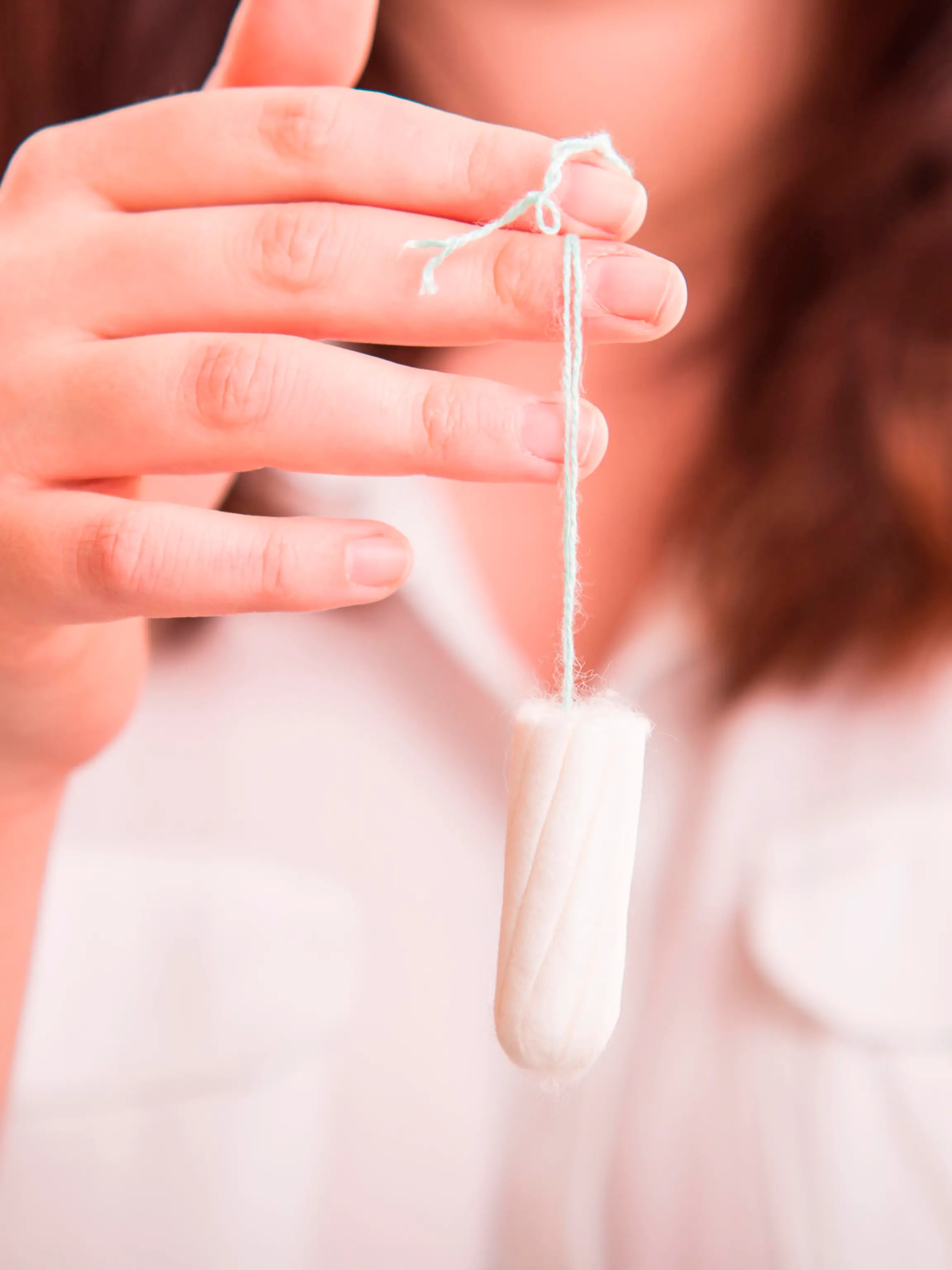 Vaginal Tapopon in woman's hand - studio shot