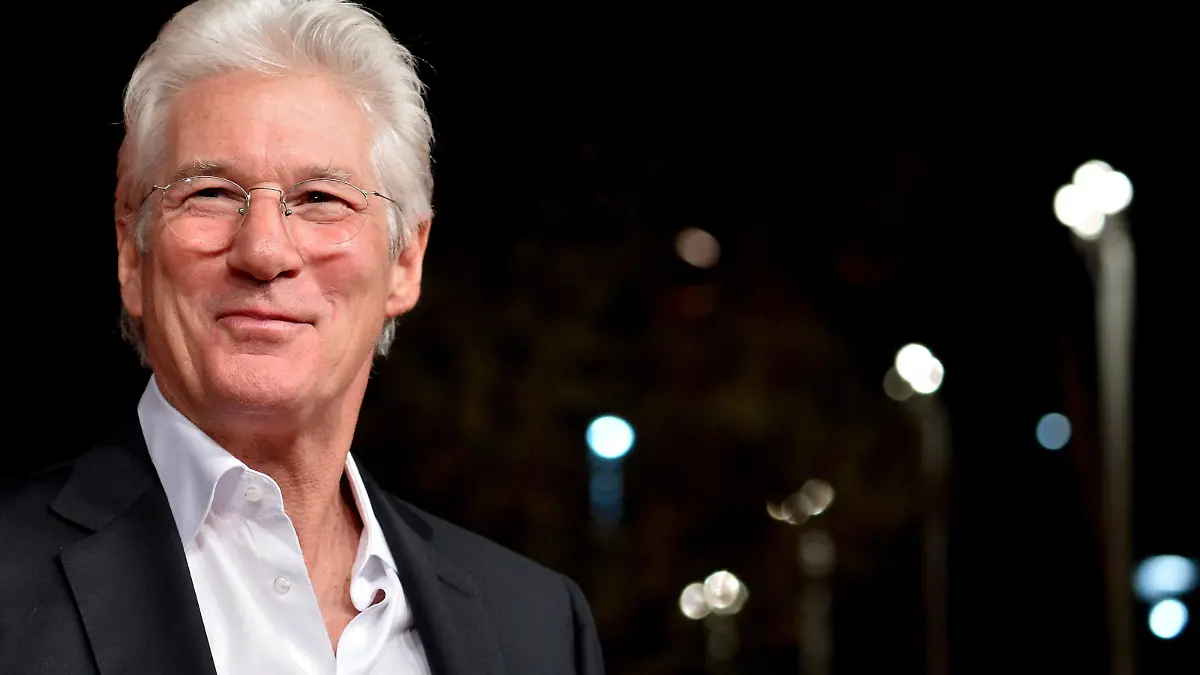 Actor Richard Gere poses on the red carpet as he arrives for the screening of the movie "Time out of mind" during the Rome Film Festival, on October 19, 2014 in Rome. AFP PHOTO/ TIZIANA FABI        (Photo credit should read TIZIANA FABI/AFP/Getty Images)