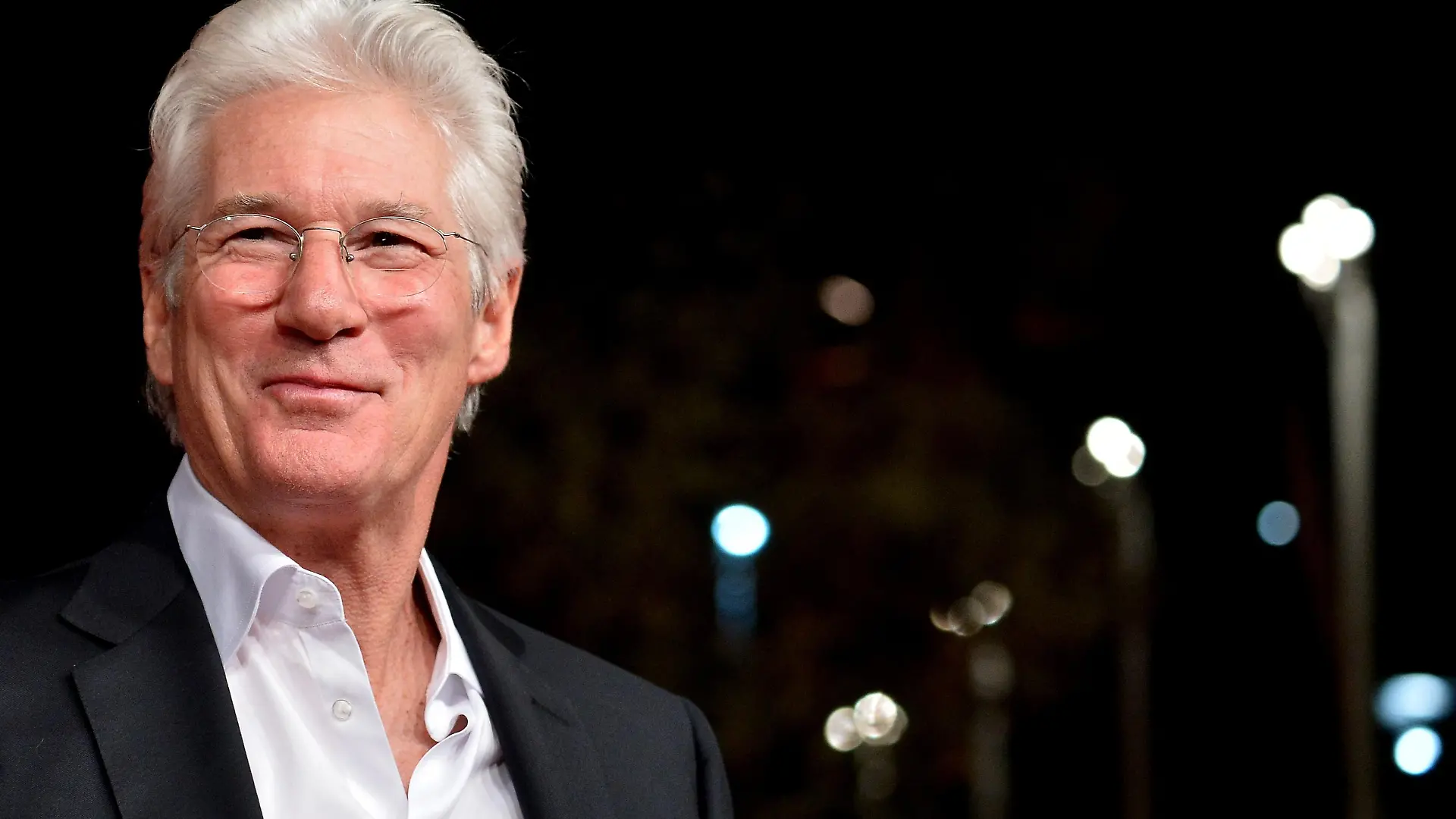 Actor Richard Gere poses on the red carpet as he arrives for the screening of the movie "Time out of mind" during the Rome Film Festival, on October 19, 2014 in Rome. AFP PHOTO/ TIZIANA FABI (Photo credit should read TIZIANA FABI/AFP/Getty Images)