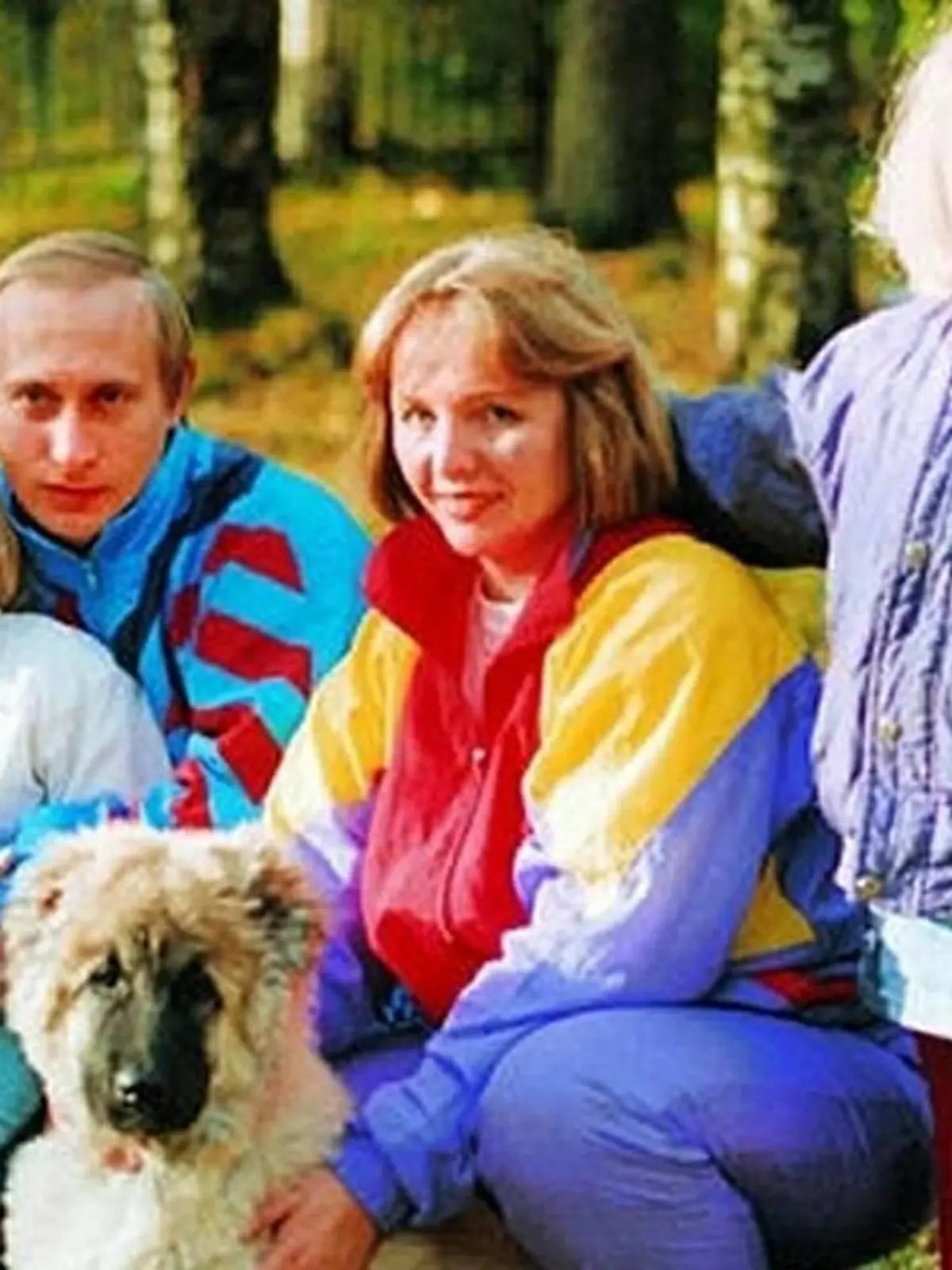  Before rising to power as one of the most infamous leaders in the world, Putin was a playful, hipster-dressing man in love. circa 1990 - Russia - Young Vladimir Putin with his wife Lyudmila and daughters. St. Petersburg Russia  - ZUMAz03_ 79668006st Copyright: xRussianxArchivesx