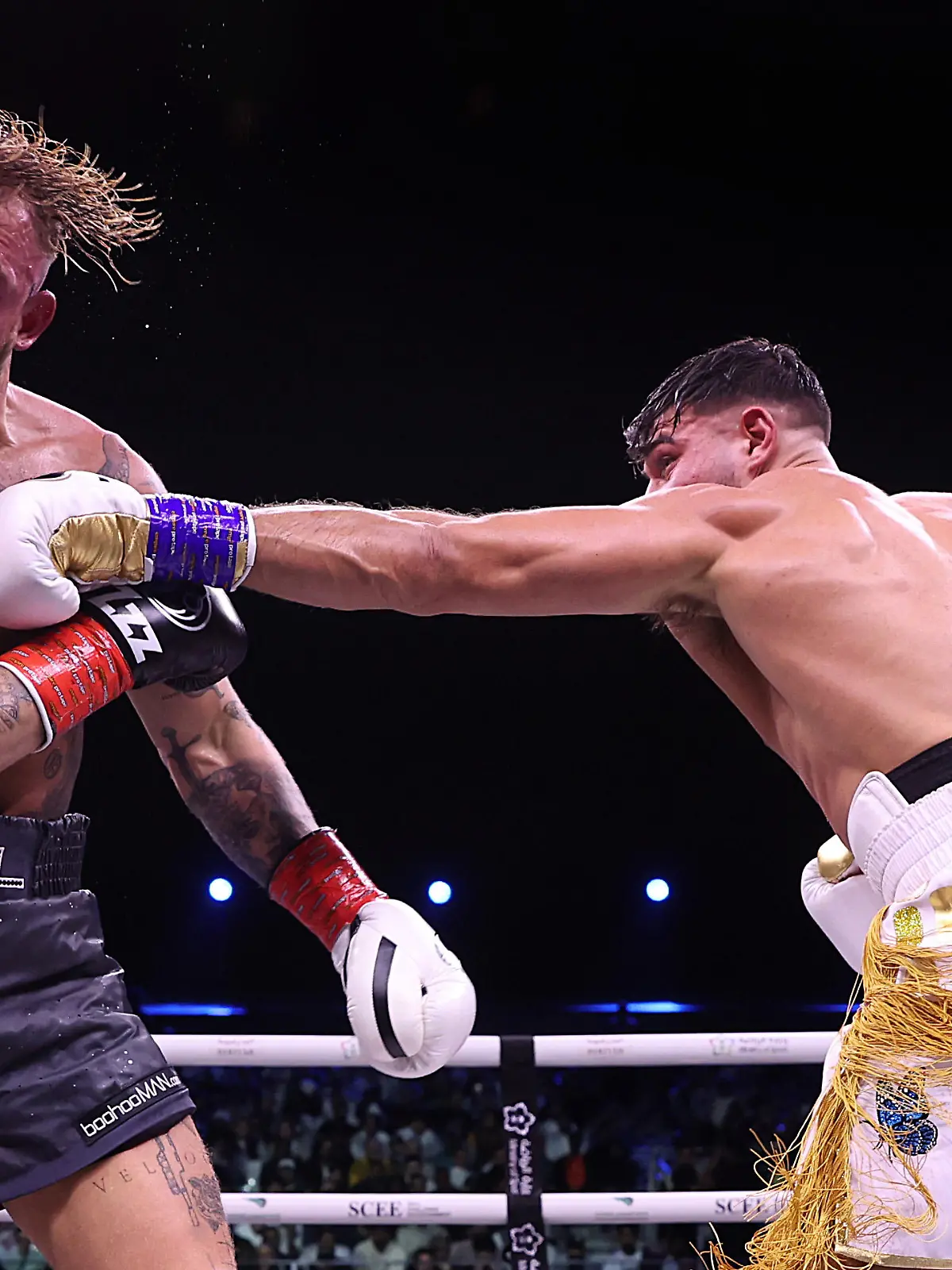 RIYADH, SAUDI ARABIA - FEBRUARY 26: Tommy Fury punches Jake Paul during the Cruiserweight Title fight between Jake Paul and Tommy Fury at the Diriyah Arena on February 26, 2023 in RIYADH, Saudi Arabia. (Photo by Francois Nel/Getty Images)