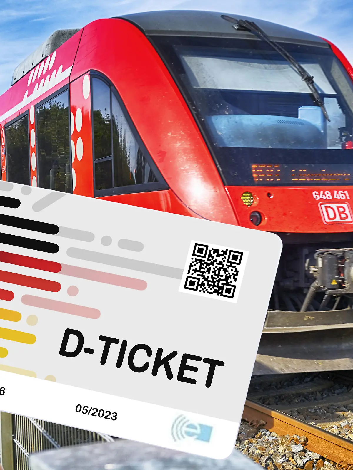 Hand hält das Deutschlandticket D-Ticket vor einer Regionalbahn / action press