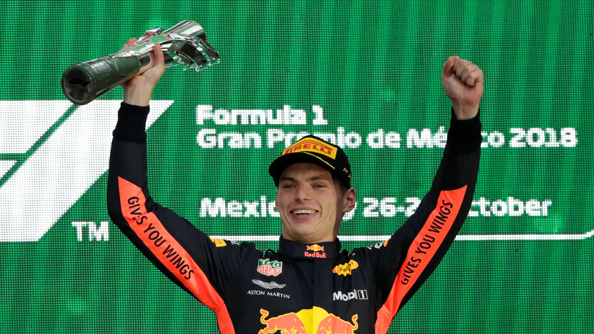 Formula One F1 - Mexican Grand Prix - Autodromo Hermanos Rodriguez, Mexico City, Mexico - October 28, 2018 Red Bull's Max Verstappen celebrates winning the race with the trophy on the podium REUTERS/Henry Romero