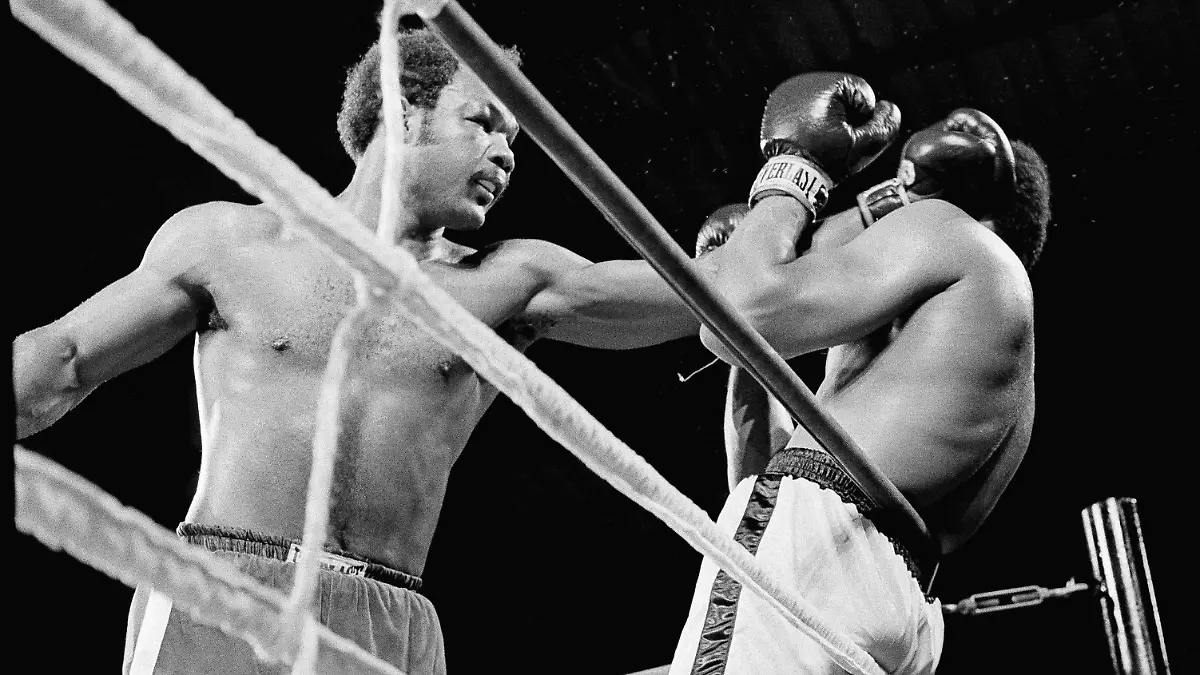 Heavyweight champion George Foreman, left,  has Muhammad Ali on the ropes in the first round of their title bout early in Kinshasa, Zaire, October 30, 1974.    (AP Photo)
