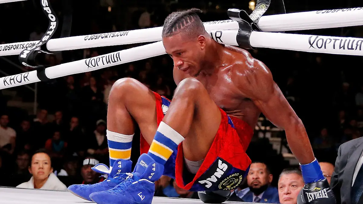 Oct 12, 2019; Chicago, IL, USA; Patrick Day (red trunks) reacts after getting knocked down by Charles Conwell (not pictured) during a USBA Super-Welterweight boxing match at Wintrust Arena. Mandatory Credit: Jon Durr-USA TODAY Sports
