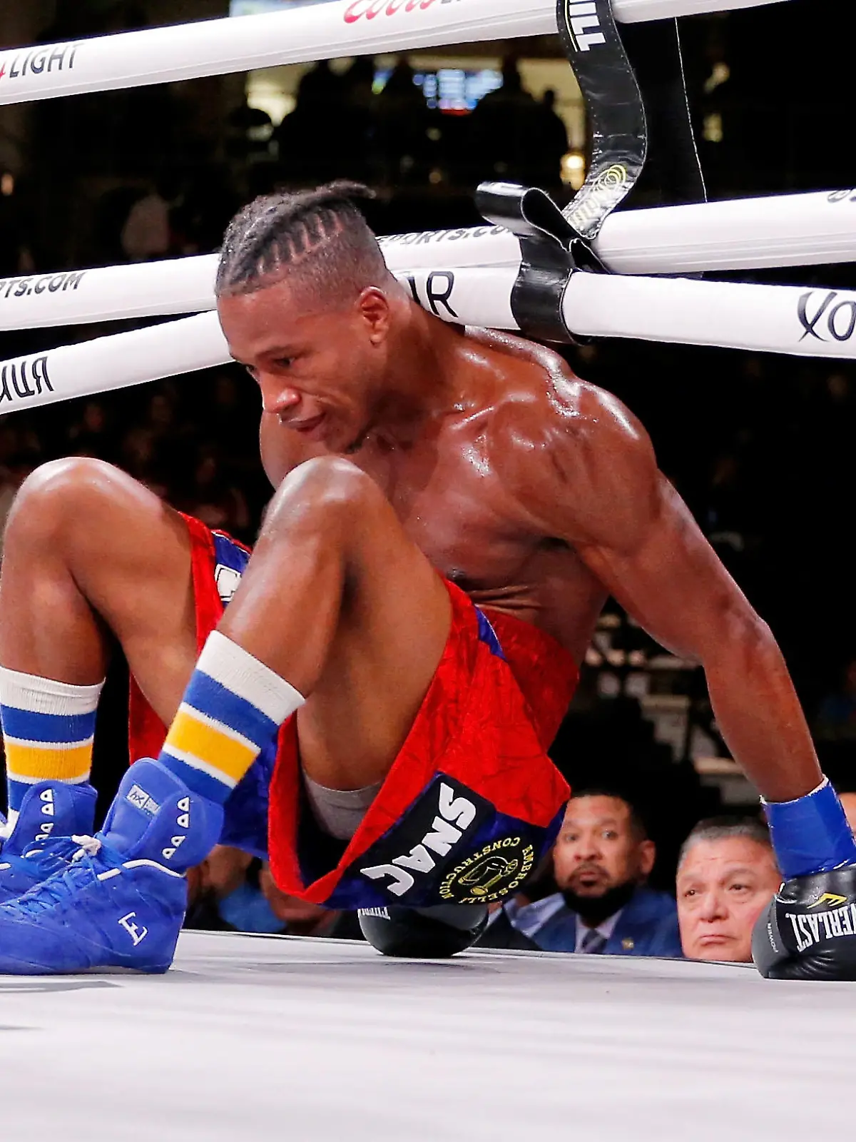 Oct 12, 2019; Chicago, IL, USA; Patrick Day (red trunks) reacts after getting knocked down by Charles Conwell (not pictured) during a USBA Super-Welterweight boxing match at Wintrust Arena. Mandatory Credit: Jon Durr-USA TODAY Sports