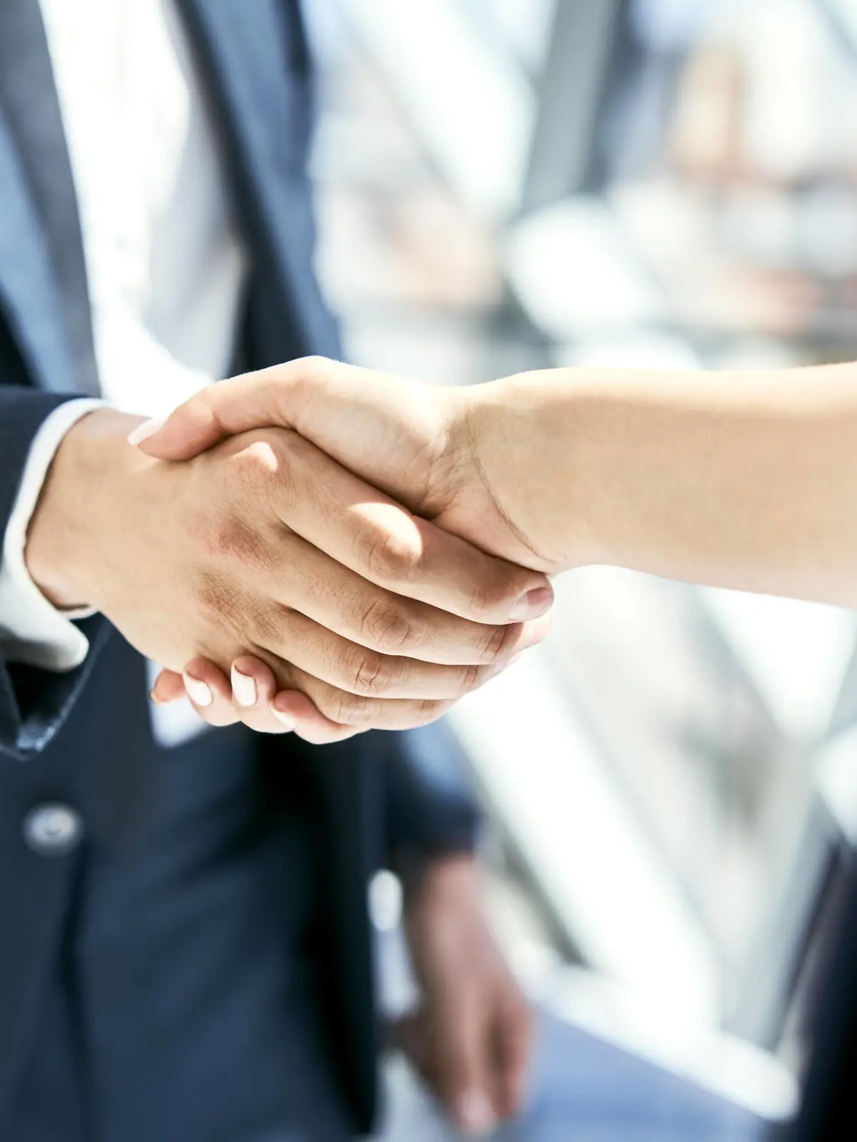 Close-up of handshake of businesswoman and businessman model released Symbolfoto property released PUBLICATIONxINxGERxSUIxAUTxHUNxONLY BSZF00466  