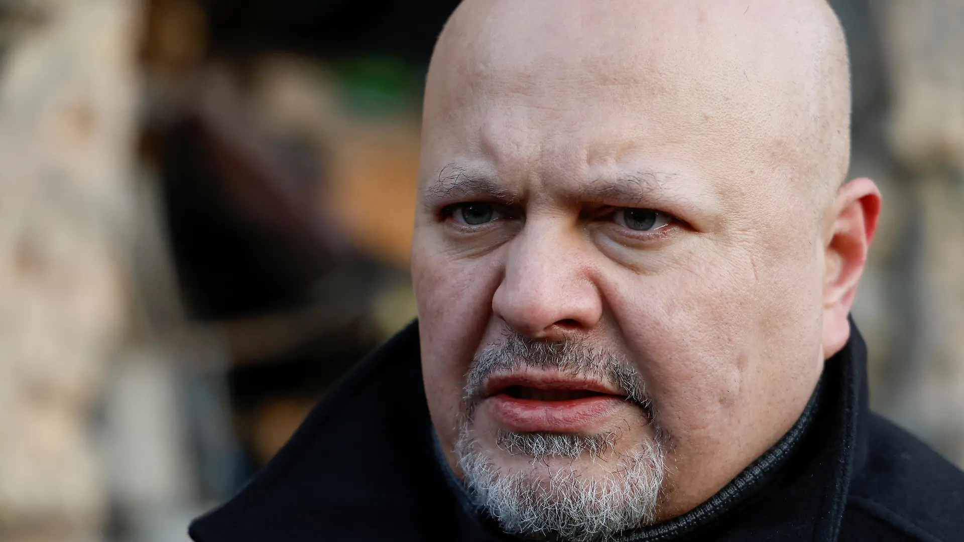 International Criminal Court (ICC) Prosecutor Karim Khan visits the site of a residential building damaged by a Russian missile strike late November, amid Russia's attack on Ukraine, in the town of Vyshhorod, outside Kyiv, Ukraine, February 28, 2023. REUTERS/Valentyn Ogirenko