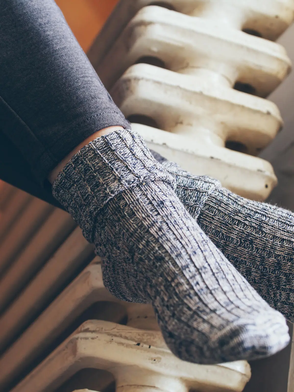 woman legs on radiator