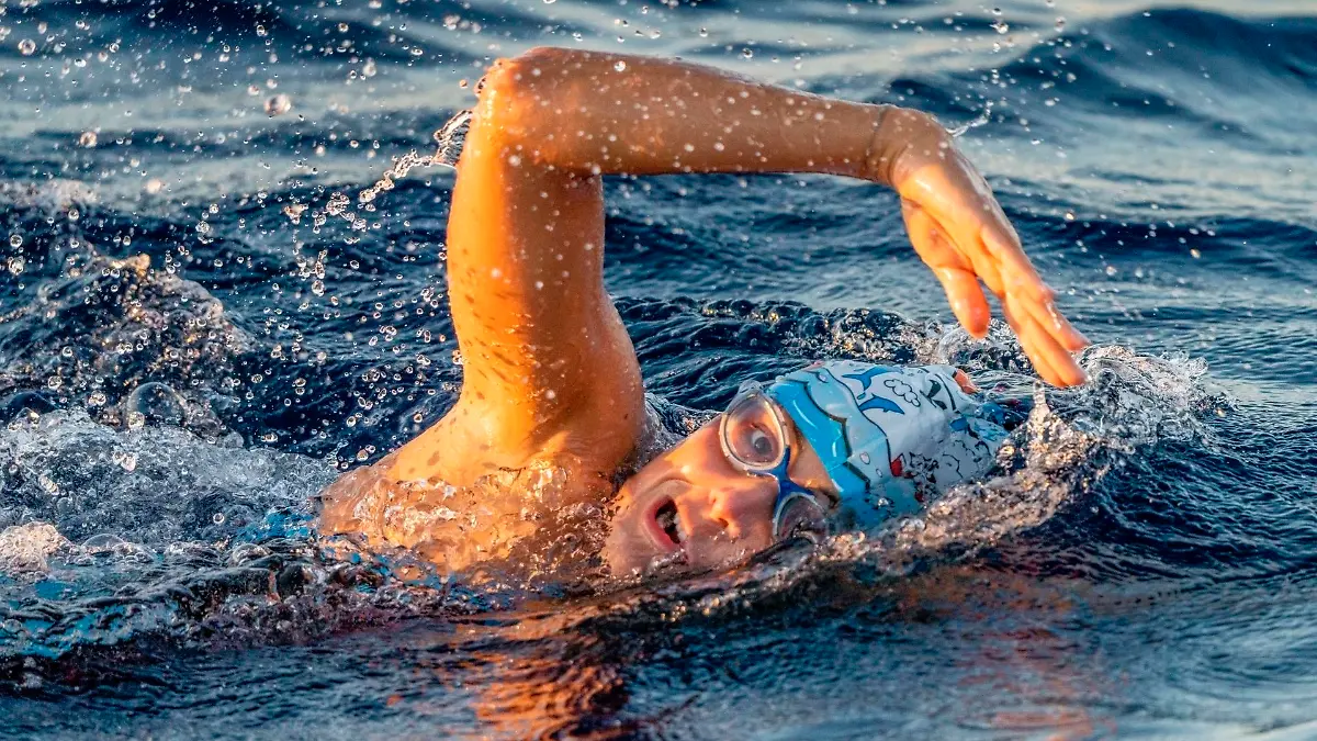 In this image released on Thursday, June 10th 2021, Nathalie Pohl swims the Menorca Channel. Pohl's time of 9h50s was an hour faster than the previous record holder and only 26 minutes slower than the fastest man. HANDOUT IMAGE - please refer to special instructions. (Marc Le Cornu/NP-Invest GmbH/news aktuell via AP Images)