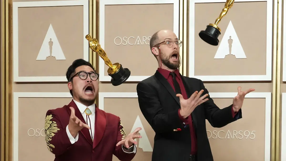 Daniel Kwan, left, and Daniel Scheinert, winners of the award for best director for “Everything Everywhere All at Once,” pose in the press room at the Oscars on Sunday, March 12, 2023, at the Dolby Theatre in Los Angeles. (Photo by Jordan Strauss/Invision/AP)