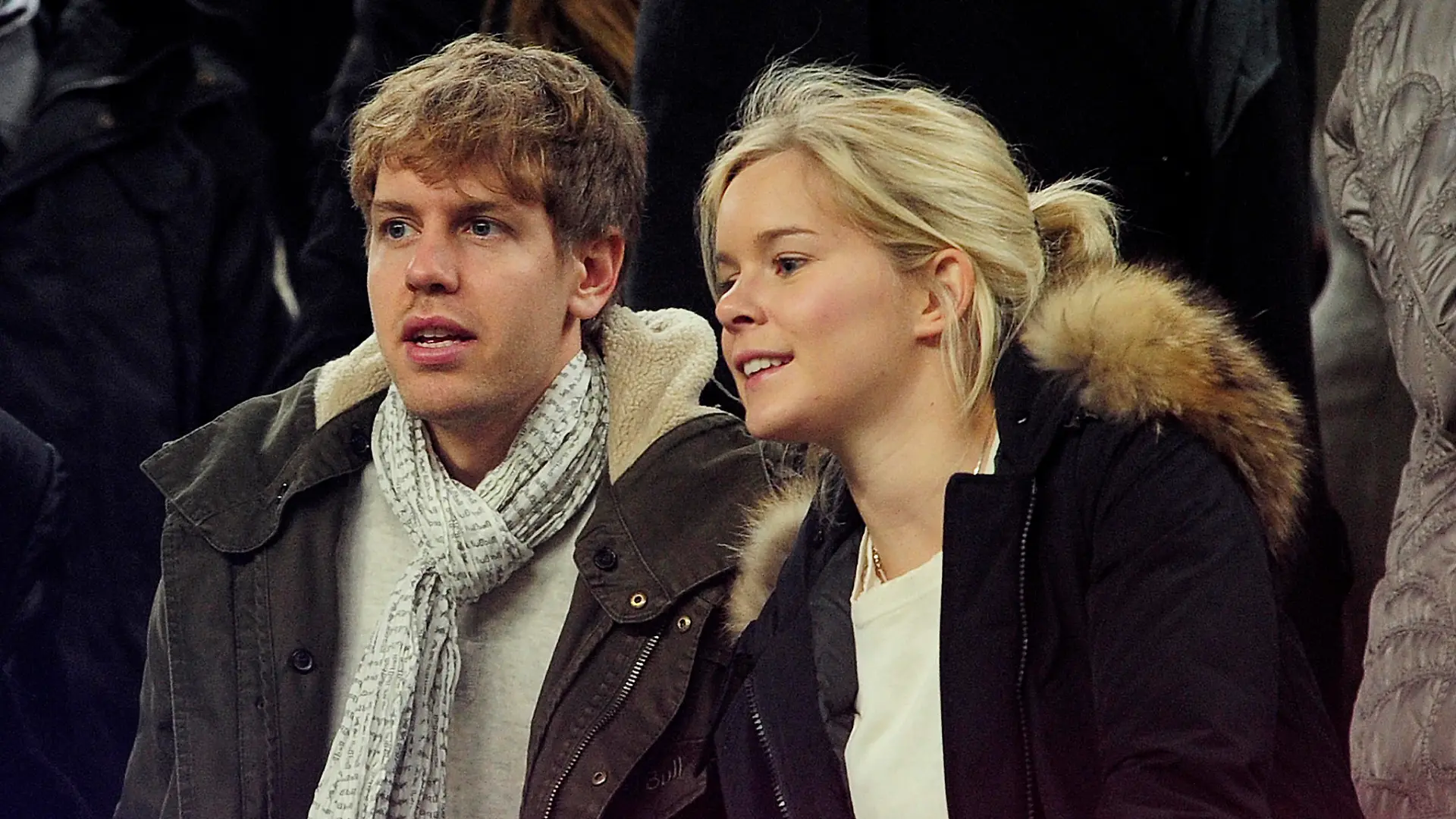 German Formula 1 and Grand Prix driver Sebastian Vettel (L) and his girlfriend Hanna Prater look at the playing field during the Spanish league football match between FC Barcelona and Valencia CF on February 19, 2012, at the Camp Nou stadium in Barcelona. AFP PHOTO / JOSEP LAGO (Photo credit should read JOSEP LAGO/AFP/Getty Images)