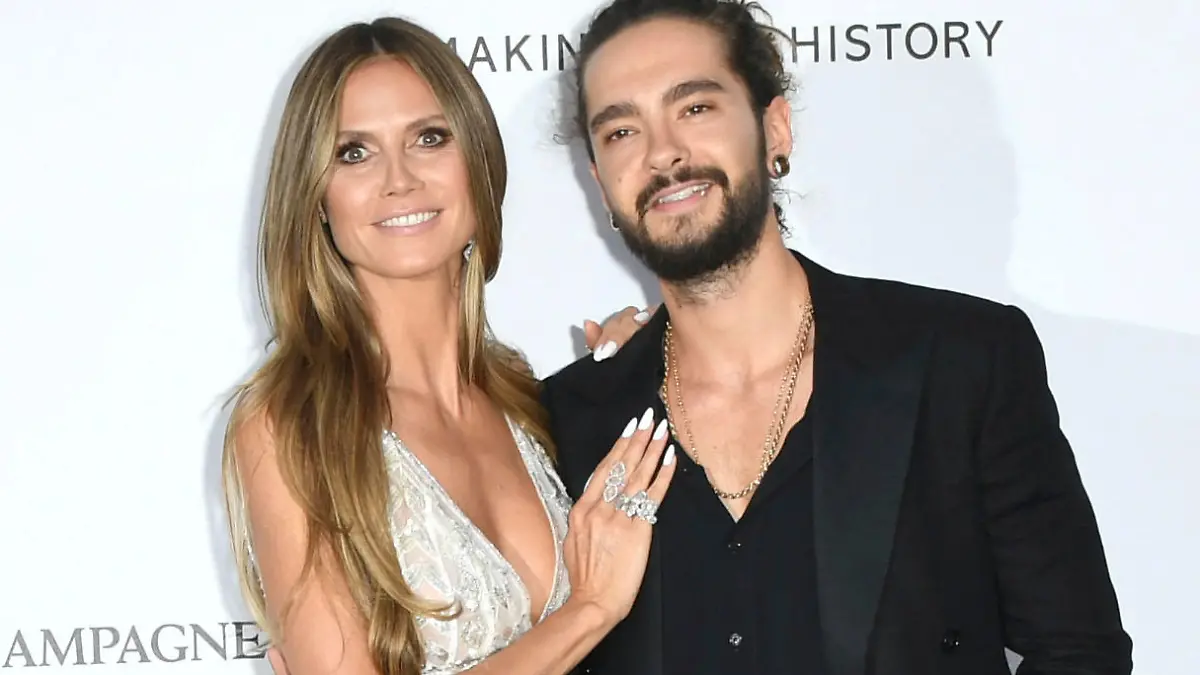 ARCHIV - 17.05.2018, Frankreich, Cannes: Heidi Klum, Moderatorin von  «Germany's Next Topmodel», und ihr Partner Tom Kaulitz, Gitarrist der Band Tokio Hotel, kommen zur amfAR-Benefiz-Veranstaltung «Cinema Against AIDS» im Rahmen des 71. Filmfestivals. (zu dpa-Korr "Heidi, komm heim: Entgeht Bergisch Gladbach die Hochzeit des Jahres?") Foto: Arthur Mola/Invision/AP/dpa +++ dpa-Bildfunk +++
