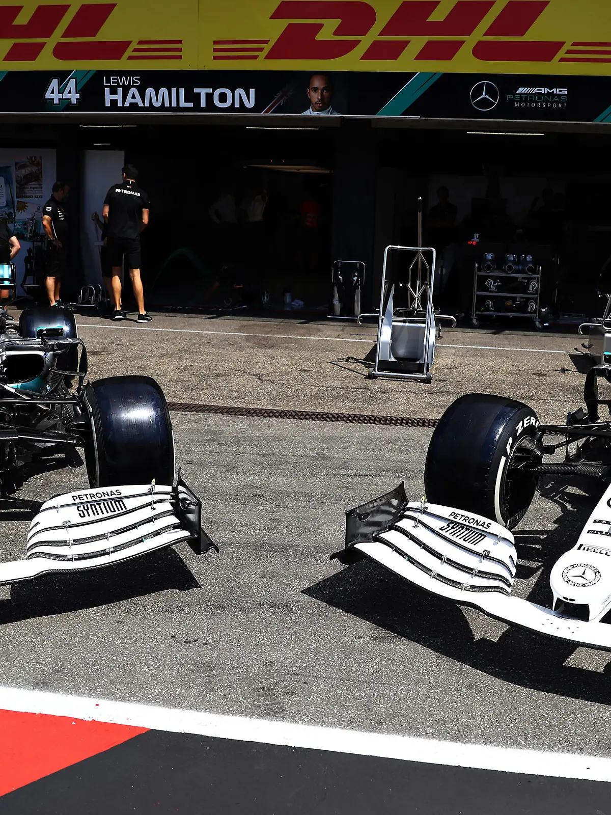 HOCKENHEIM, GERMANY - JULY 25: The Mercedes GP team show off their car with a new white and silver livery in the Pitlane during previews ahead of the F1 Grand Prix of Germany at Hockenheimring on July 25, 2019 in Hockenheim, Germany. (Photo by Lars Baron/Getty Images)