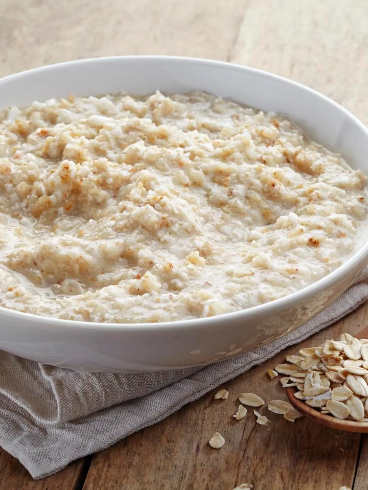 Bowl of various flakes porridge on wooden table