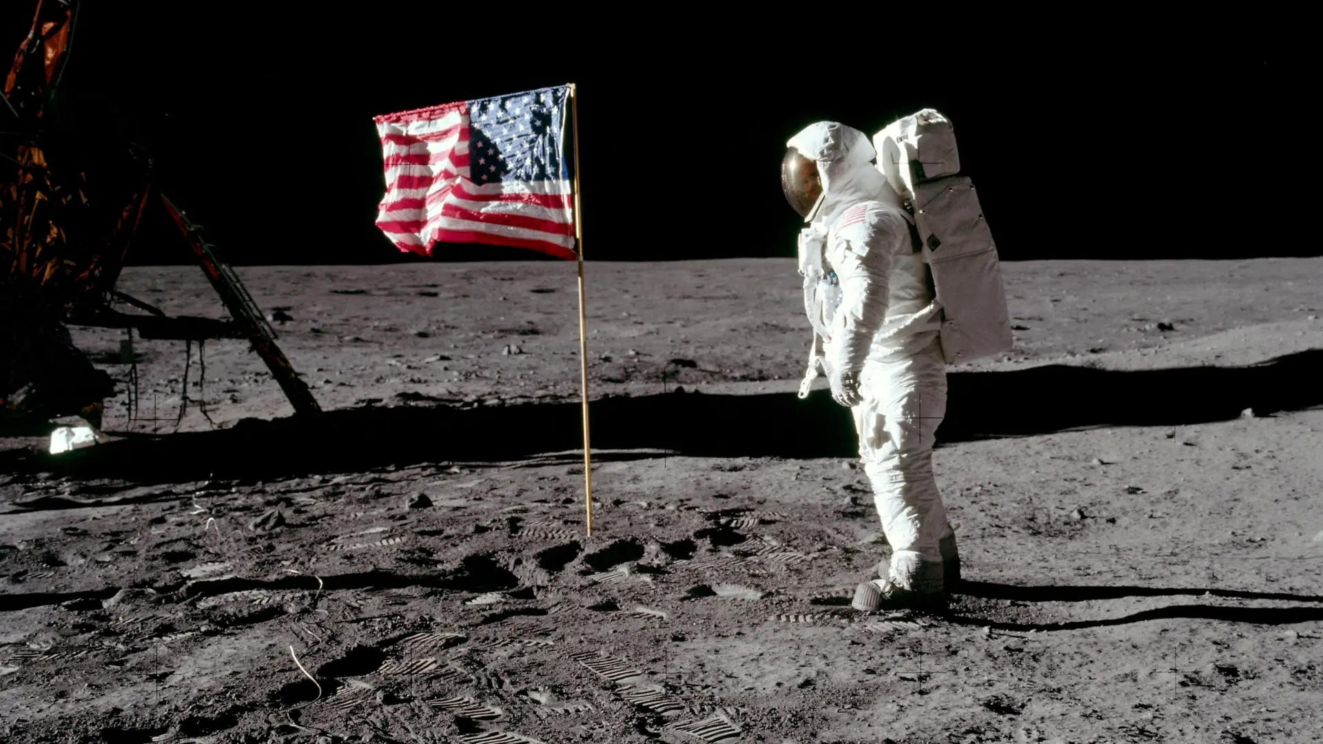 FILE PHOTO: Astronaut Buzz Aldrin, lunar module pilot for Apollo 11, poses for a photograph besides the deployed United States flag during an extravehicular activity (EVA) on the moon, July 20, 1969. The lunar module (LM) is on the left, and the footprints of the astronauts are visible in the soil. Neil Armstrong/NASA/Handout via REUTERS/File Photo   ATTENTION EDITORS - THIS IMAGE HAS BEEN SUPPLIED BY A THIRD PARTY     TPX IMAGES OF THE DAY    PLEASE SEARCH "50TH ANNIVERSARY OF THE MOON LANDING" FOR ALL PICTURES