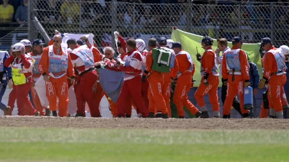 11 July 1999: Doctors attend to Michel Schumacher of Germany and Ferrari after he hit a wall during the 1999 British Grand Prix held at SilverStone in Northampton, England. \ Mandatory Credit: Andrew Redington /Allsport