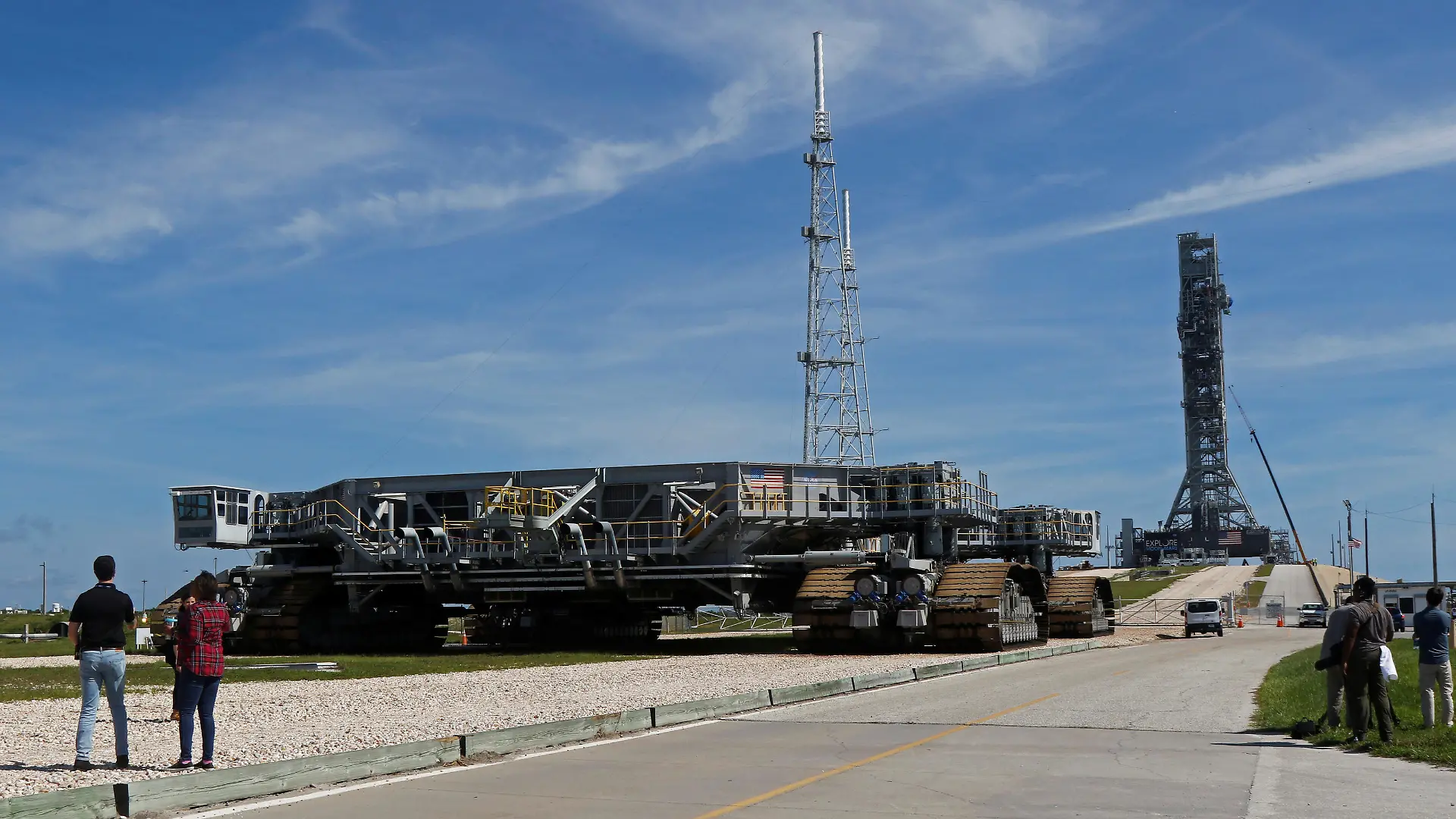 NASA's Space Launch System mobile launcher(R) stands atop Launch Pad 39B for months of testing before it will launch the SLS rocket and Orion spacecraft on mission Artemis 1 at the Kennedy Space Center in Cape Canaveral, Florida, U.S., July 1, 2019. At left is a crawler/transporter, which rolled the launcher to the pad.  REUTERS/Thom Baur