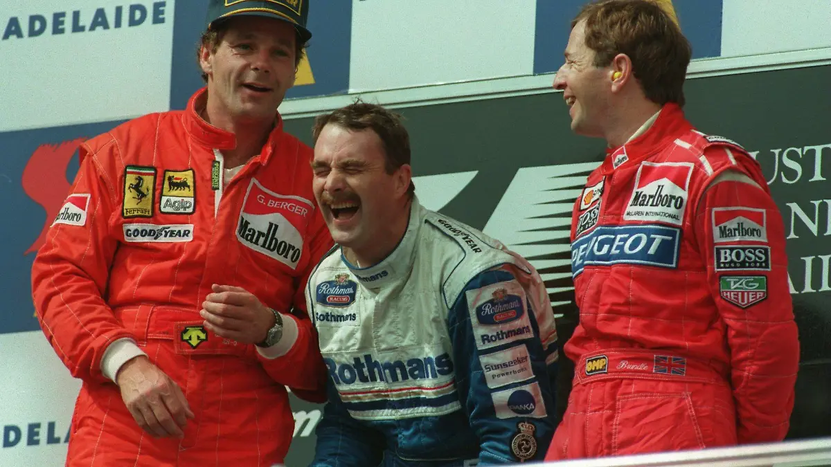 13 NOV 1994:  LEFT TO RIGHT:  SECOND PLACE FINISHER, FERRARI's GERHARD BERGER, WINNER, NIGEL MANSELL AND MARTIN BRUNDLE, THE THIRD PLACE FINISHER, SHARE A JOKE ON THE PODIUM AFTER THE AUSTRALIAN GRAND PRIX IN ADELAIDE. Mandatory Credit: Mike Hewitt/ALLSPORT