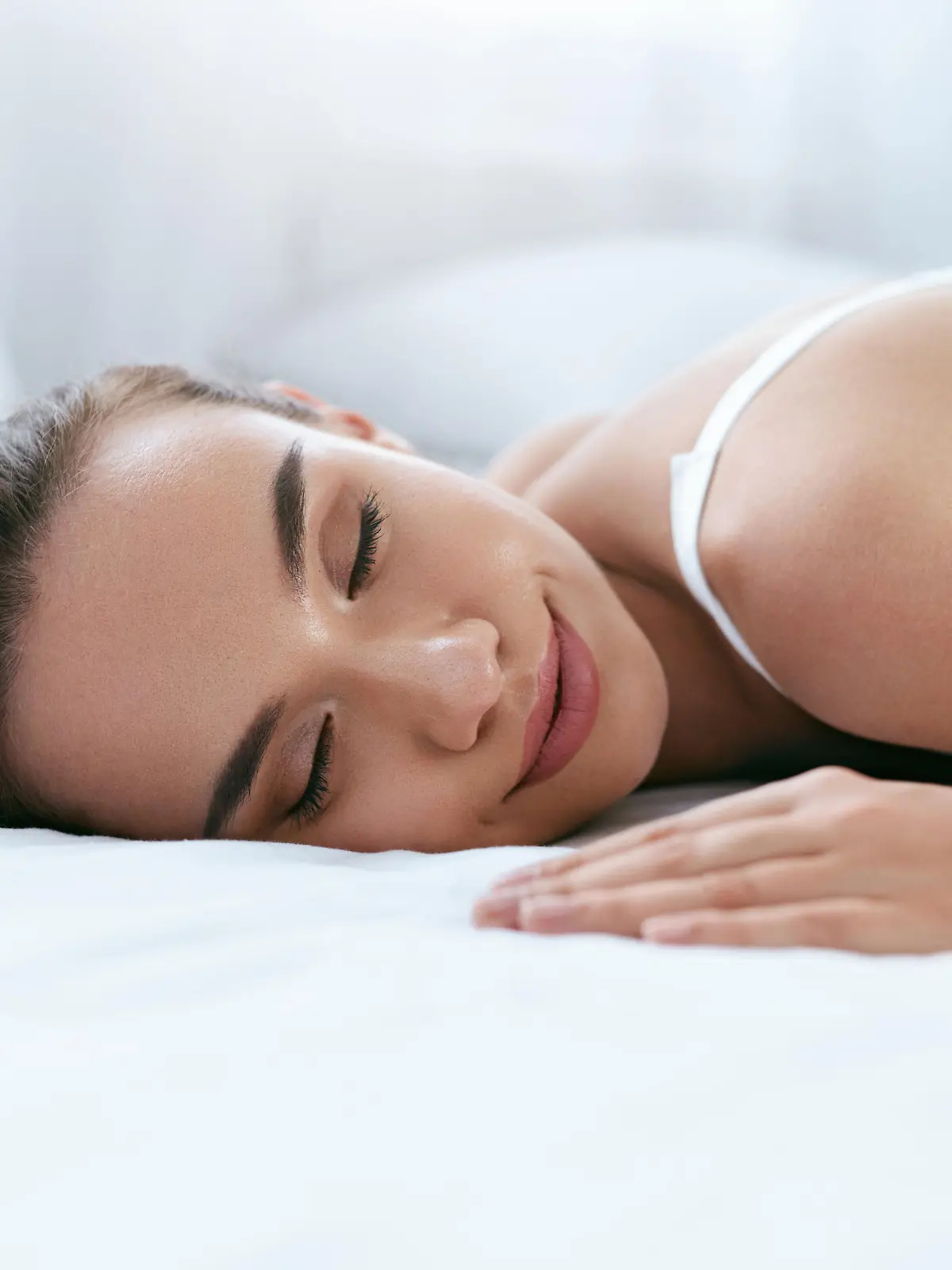 Beautiful Woman Sleeping On White Bed In Light Interior. Healthy Sleep. High Resolution