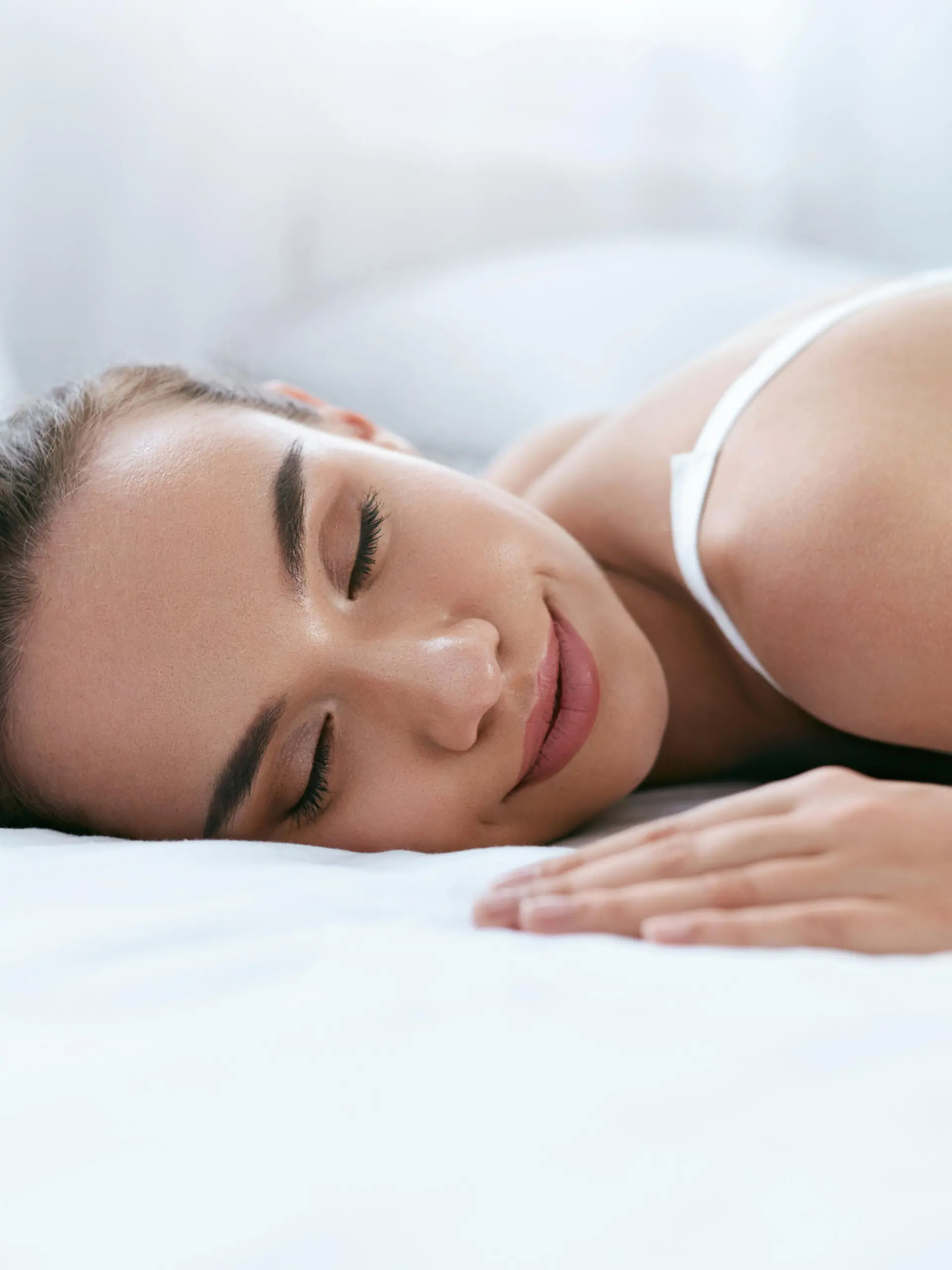 Beautiful Woman Sleeping On White Bed In Light Interior. Healthy Sleep. High Resolution