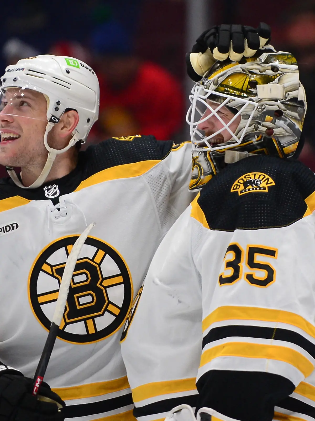 Feb 25, 2023; Vancouver, British Columbia, CAN; Boston Bruins goaltender Linus Ullmark (35) celebrates his empty net goal during the third period at Rogers Arena. Mandatory Credit: Anne-Marie Sorvin-USA TODAY Sports