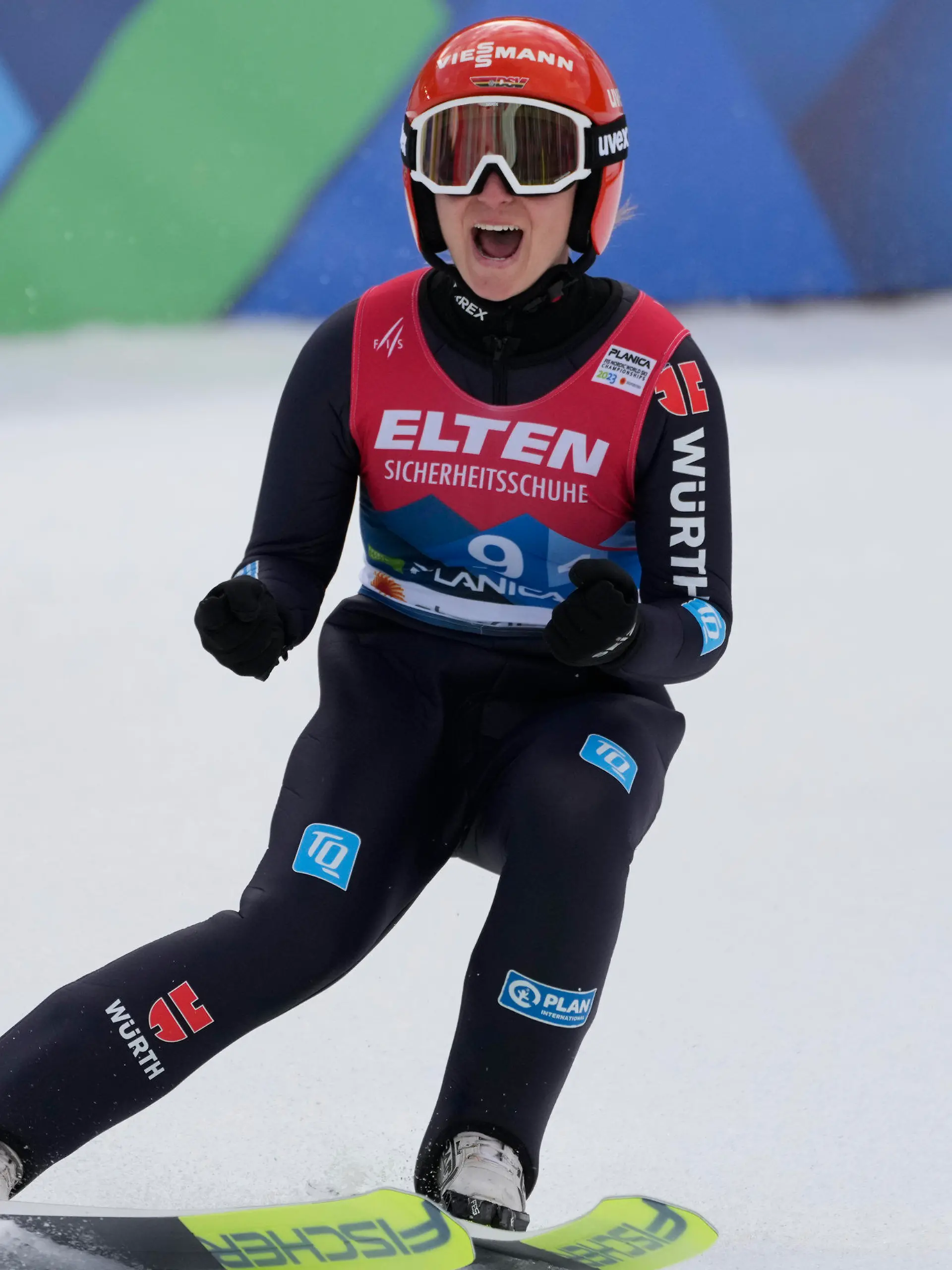 Germany's Katharina Althaus celebrates her team victory after her jump at the Team Women HS100 competition at the Nordic World Championships in Planica, Slovenia, Saturday, Feb. 25, 2023. (AP Photo/Darko Bandic)