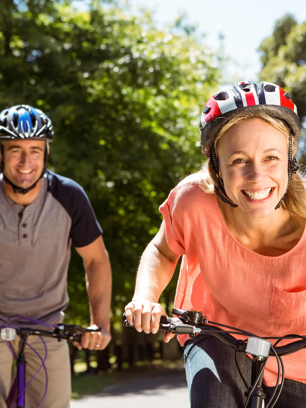 Happy couple on a bike ride on a sunny day