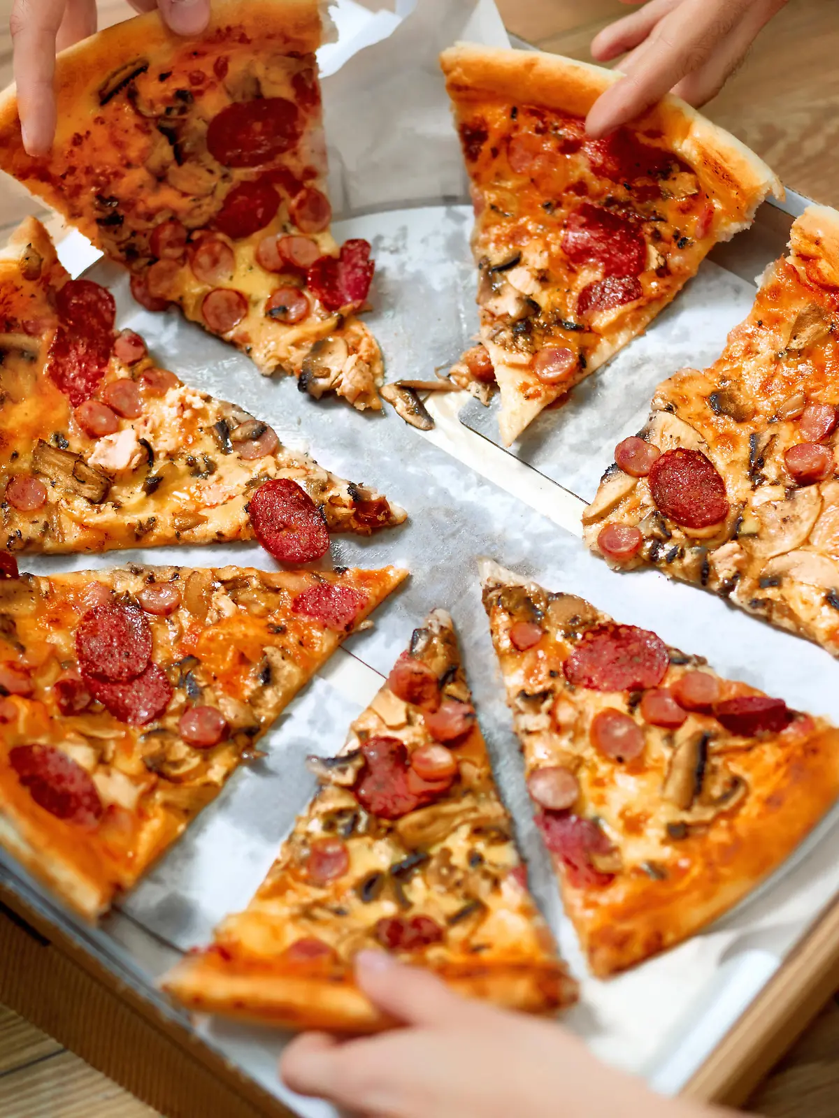 Eating Food. Close-up Of People Hands Taking Slices Of Pepperoni Pizza. Group Of Friends Sharing Pizza Together. Fast Food, Friendship, Leisure, Lifestyle.