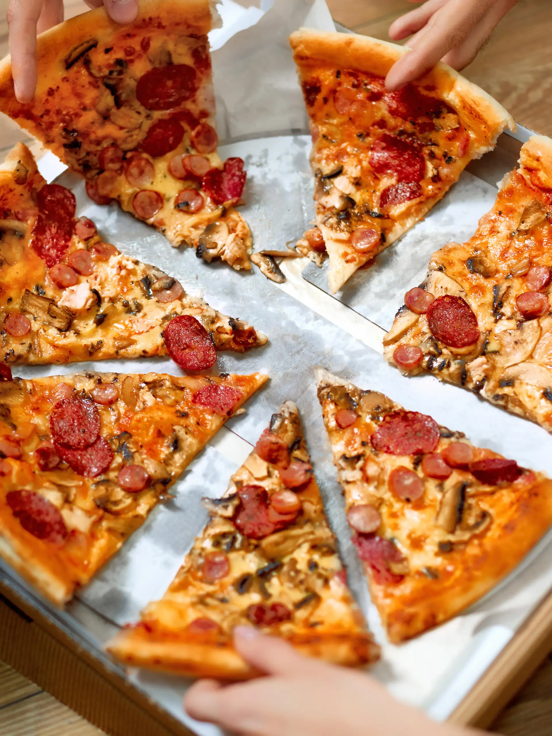 Eating Food. Close-up Of People Hands Taking Slices Of Pepperoni Pizza. Group Of Friends Sharing Pizza Together. Fast Food, Friendship, Leisure, Lifestyle.