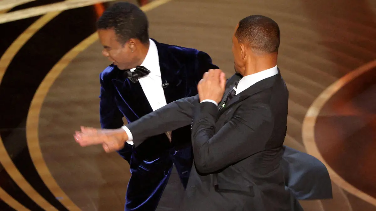 FILE PHOTO: Will Smith hits Chris Rock onstage during the 94th Academy Awards in Hollywood, Los Angeles, California, U.S., March 27, 2022. REUTERS/Brian Snyder/File Photo