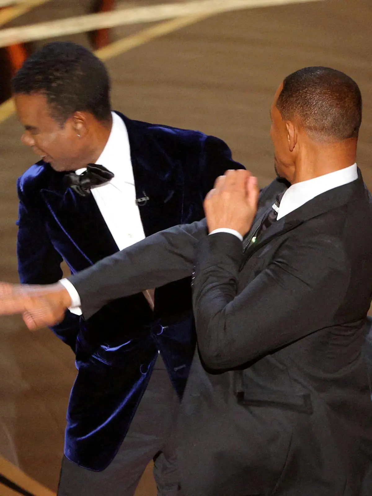 FILE PHOTO: Will Smith hits Chris Rock onstage during the 94th Academy Awards in Hollywood, Los Angeles, California, U.S., March 27, 2022. REUTERS/Brian Snyder/File Photo