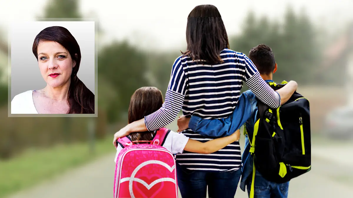 Frau mit Kindern im Arm