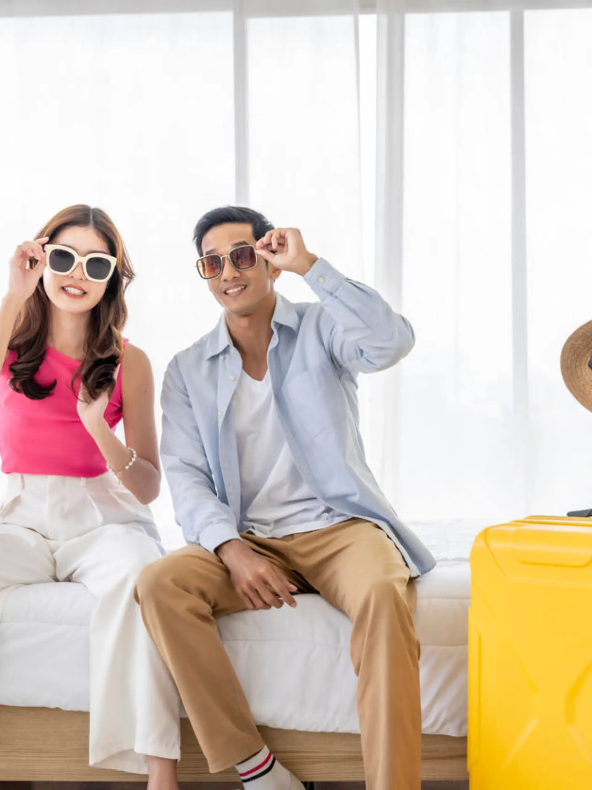 Asian couples are preparing to travel together both domestically and internationally. Have a good travel plan through the Internet. Both of them are happy and excited about going on a trip together.