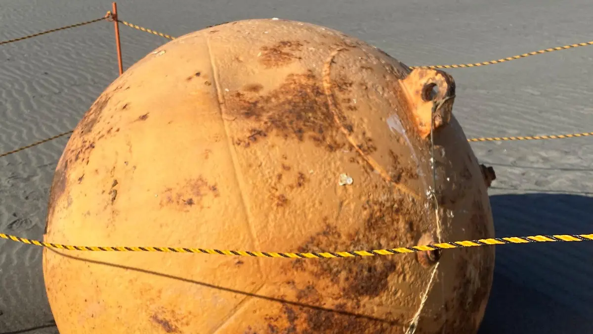 A ball is seen on a beach in Hamamatsu, Japan February 22, 2023 in this still image obtained from social media on Twitter/@XMiS10C4M6QthSG via REUTERS THIS IMAGE HAS BEEN SUPPLIED BY A THIRD PARTY. MANDATORY CREDIT. NO RESALES. NO ARCHIVES.