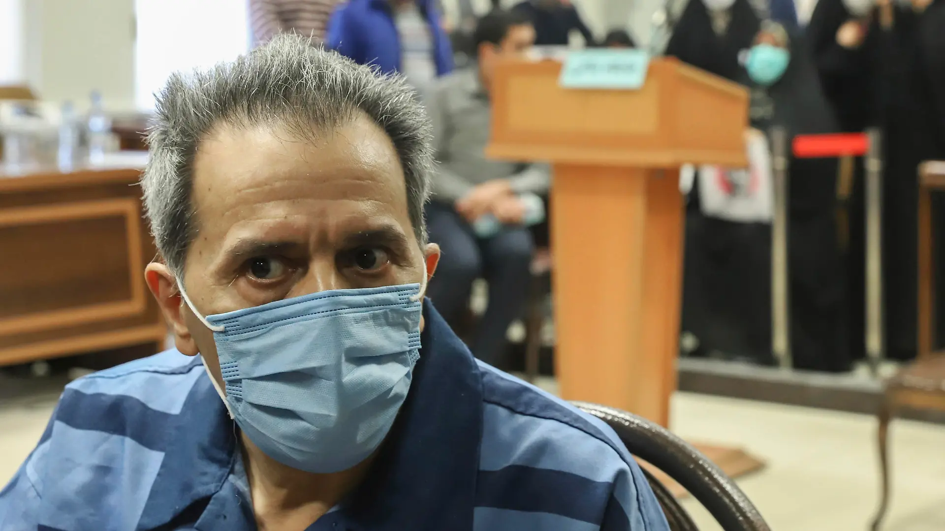 Iranian-German national and U.S. resident Jamshid Sharmahd, the alleged leader of the militant wing of a U.S.-based Iranian opposition group who is accused of planning a 2008 bombing at a mosque that killed 14 people and wounded over 200 in Iran, attends his trial at the Revolutionary Court, in Tehran, Iran, Sunday, Feb. 6, 2022. (Koosha Mahshid Falahi/Mizan News Agency via AP)