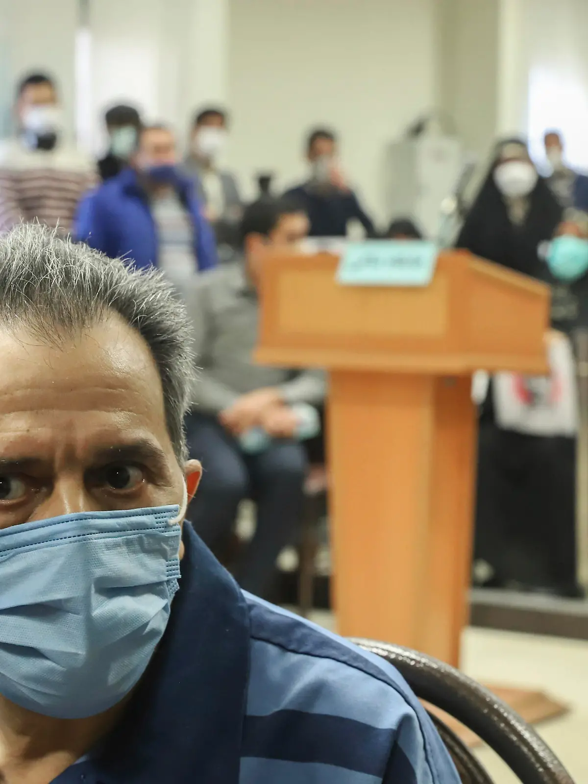 Iranian-German national and U.S. resident Jamshid Sharmahd, the alleged leader of the militant wing of a U.S.-based Iranian opposition group who is accused of planning a 2008 bombing at a mosque that killed 14 people and wounded over 200 in Iran, attends his trial at the Revolutionary Court, in Tehran, Iran, Sunday, Feb. 6, 2022. (Koosha Mahshid Falahi/Mizan News Agency via AP)