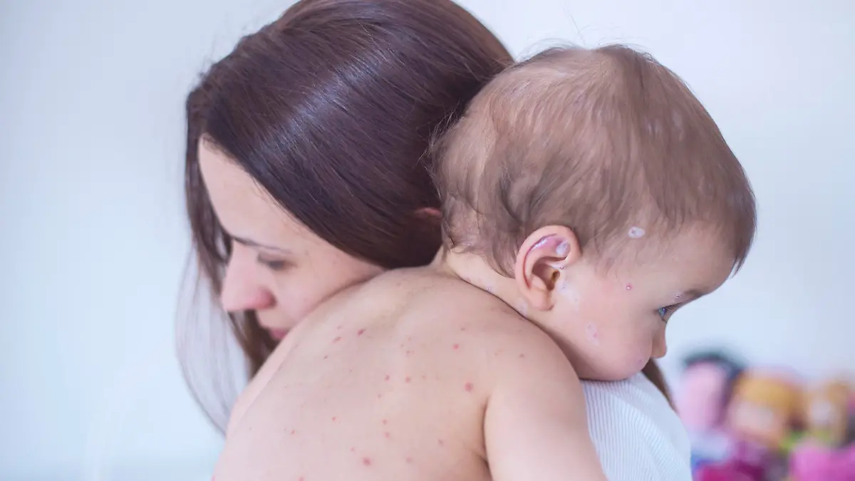 Mother nursing sick child At Home