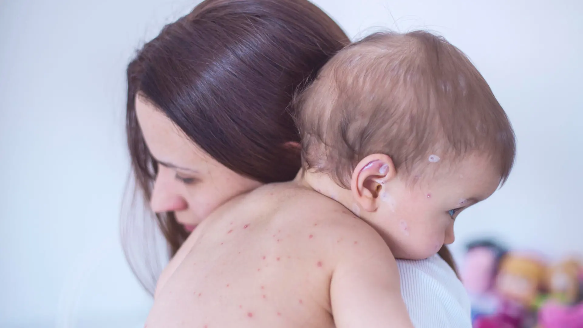 Mother nursing sick child At Home