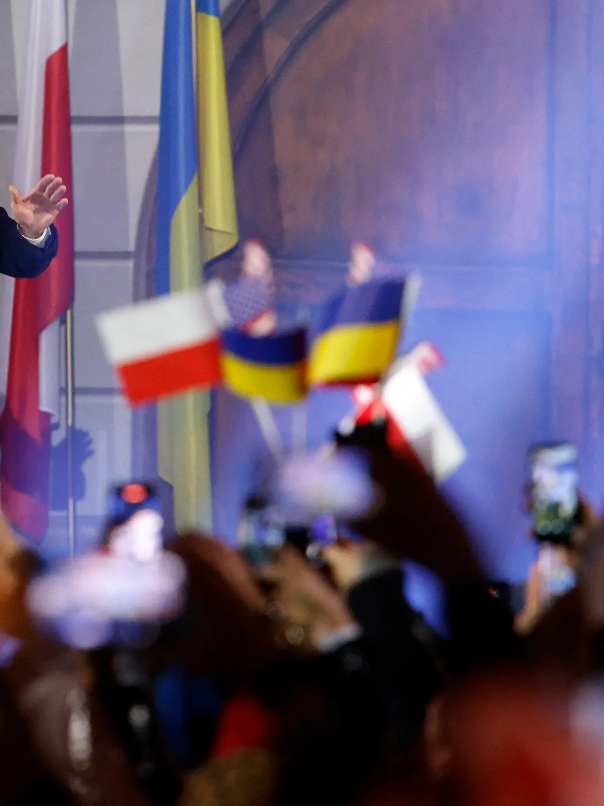 President Joe Biden waves as he arrives to hold a speech at the Royal Castle after meeting with Polish President Andrzej Duda in Warsaw, Poland, Tuesday, Feb. 21, 2023. (AP Photo/Michal Dyjuk)