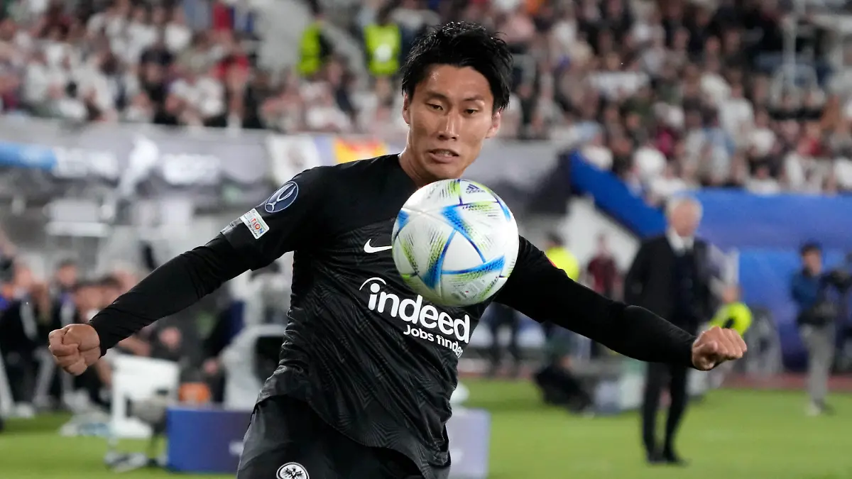 Frankfurt's Daichi Kamada kicks the ball during the UEFA Super Cup final soccer match between Real Madrid and Eintracht Frankfurt at Helsinki's Olympic Stadium, Finland, Wednesday, Aug. 10, 2022. (AP Photo/Sergei Grits)