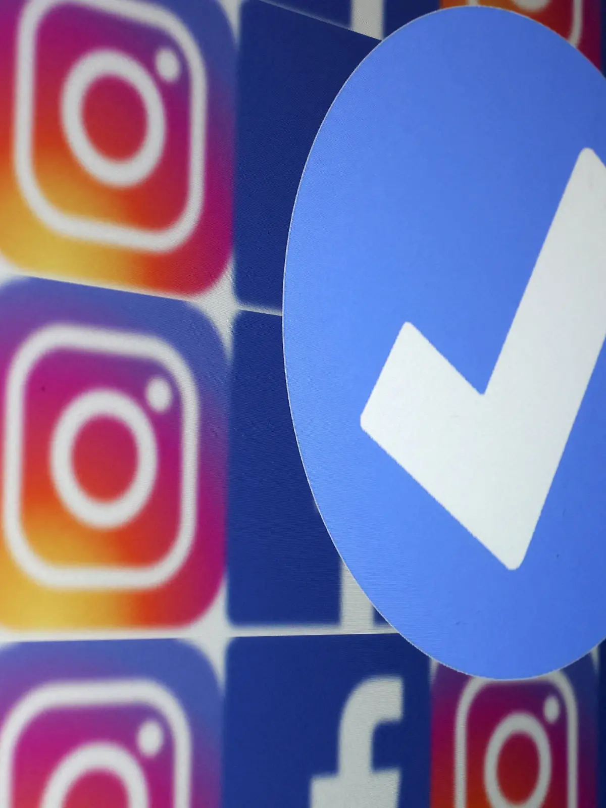 A blue verification badge and the logos of Facebook and Instagram are seen in this picture illustration taken January 19, 2023. REUTERS/Dado Ruvic/Illustration