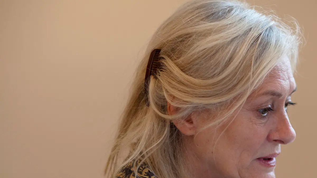 living in old people's home: senior woman gets attention - hand on shoulder