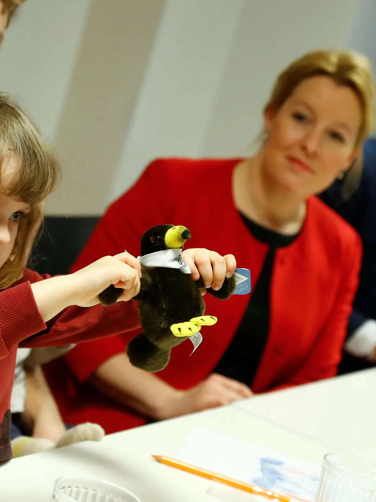 Nora Tolkmitt plays with a toy as German Minister for Family, Pensioners and Youth Franziska Giffey and Labour Minister Hubertus Heil visit a family neighbourhood centre at Berlin's Wedding district to present the new finance support law for families "Das Starke-Familien-Gesetz", Germany, January 9, 2019.    REUTERS/Fabrizio Bensch