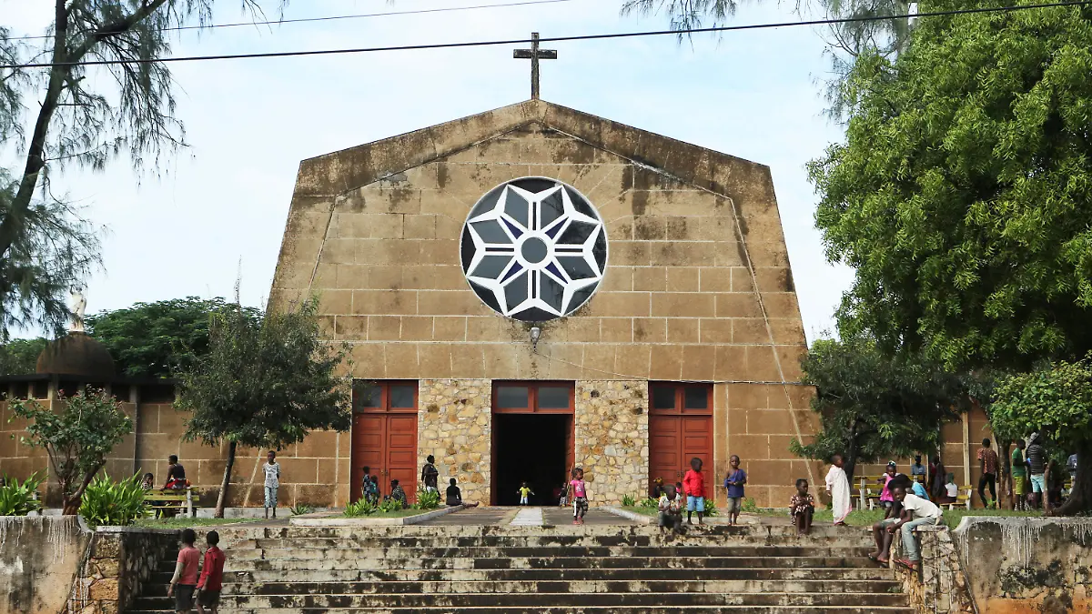 Children play outside a Roman Catholic Church in Pemba city on the northeastern coast of Mozambique in this Monday, April, 29, 2019 photo. Situated in the heart of an ethnically diverse city ravaged by Cyclone Kenneth, the Maria Auxiladora parish is housing close to 1000 people displaced by the storm which according to aid agencies has affected Cabo Delgado the countrys northern province.(AP Photo/Tsvangirayi Mukwazhi)