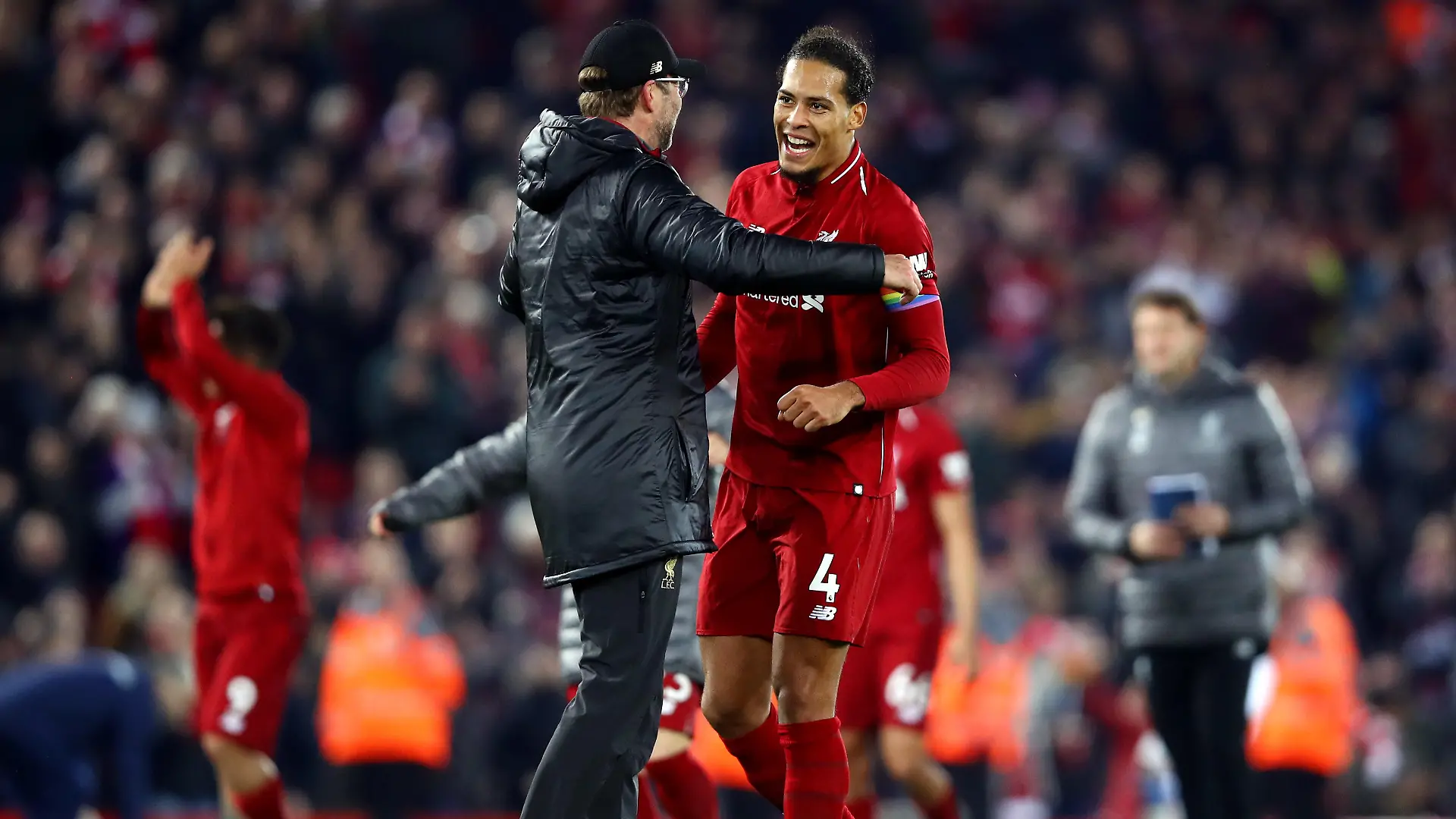 LIVERPOOL, ENGLAND - DECEMBER 02: Jurgen Klopp, Manager of Liverpool and Virgil van Dijk of Liverpool celebrate victory following the Premier League match between Liverpool FC and Everton FC at Anfield on December 2, 2018 in Liverpool, United Kingdom. (Photo by Clive Brunskill/Getty Images)