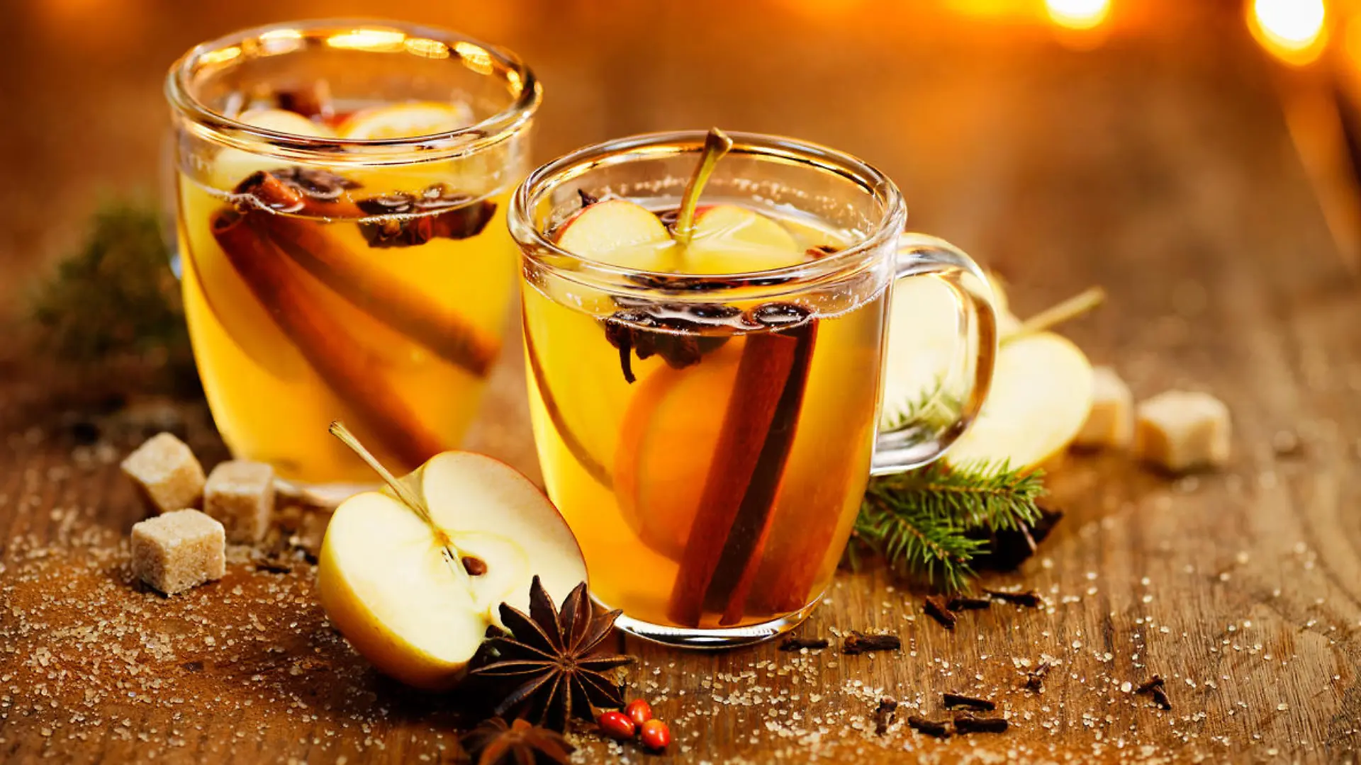 Hot cider with addition of cinnamon sticks, anise stars, cloves and citrus fruits