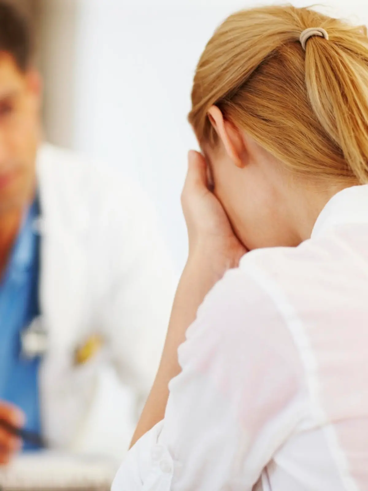 Portrait of female doctor sharing her problems with doctor in office
