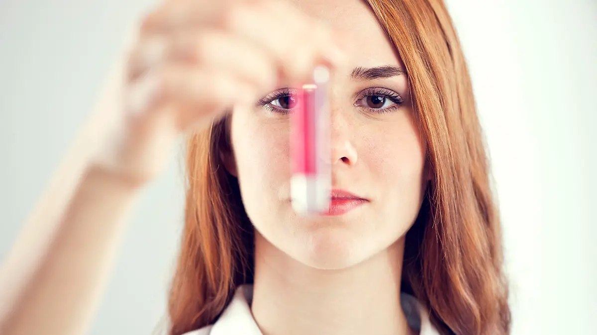 Laboratory assistant analyzing a blood sample